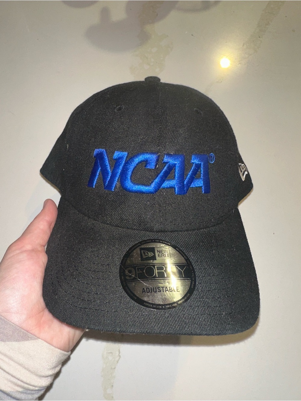 New Era Black Baseball Cap with Bold Blue NCAA Logo